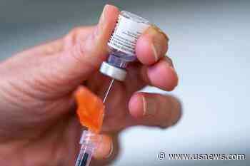 The Latest: Indiana University Modifies Vaccine Requirement