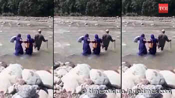 Jammu and Kashmir: Health workers cross river for Covid-19 vaccination