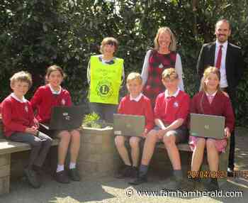 Binsted pupils get laptops from Lions | News - Farnham Herald