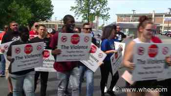 Community members, local police rally together for 'Stop the Violence' march following deadly shooting