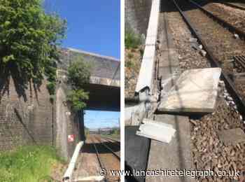 Stone pushed off bridge causing damage to cables and passing trains