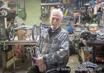 Cars he makes and gives away help this Green Tree man pedal joy