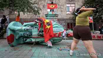 Statue of Egerton Ryerson toppled after hundreds rally in downtown Toronto