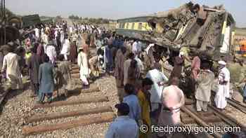Workers clear site of Pakistan train crash as death toll rises