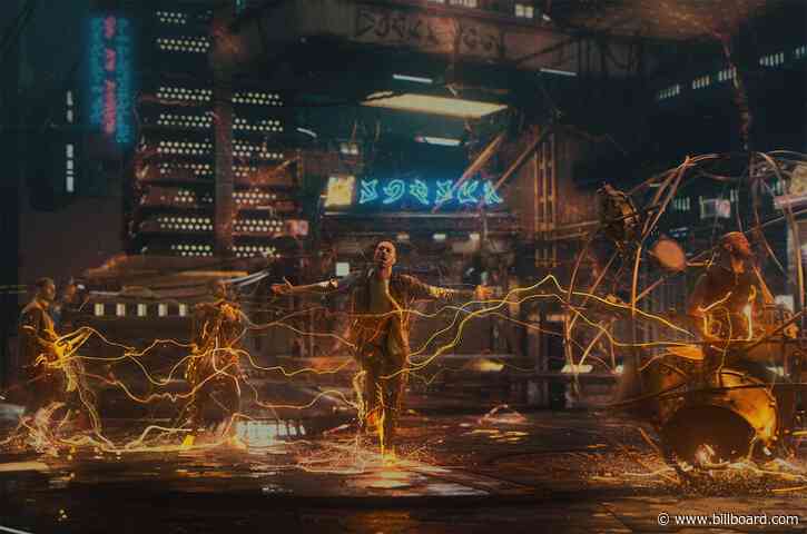 Coldplay Chill With Robot Dogs & Dancing Aliens in Futuristic ‘Higher Power’ Video