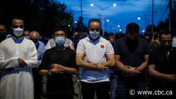 'I just want the world to know how she died': Vigil for family killed in attack draws thousands