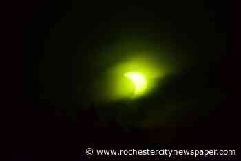 Partial eclipse draws crowd early Thursday
