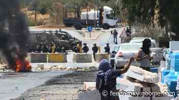 Palestinians clash with Israeli forces in the village of Beita