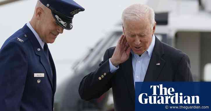 Joe Biden swats cicada from neck while boarding Air Force One – video