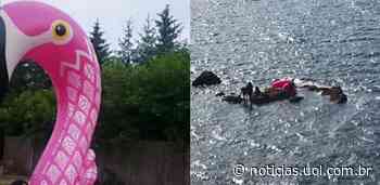 Guarda Costeira resgata 3 pessoas e 2 cães 'enganados' por boia de flamingo - UOL Notícias