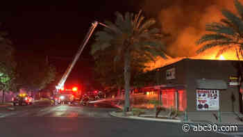 Firefighters battling large fire that spread to 4 businesses in Lindsay