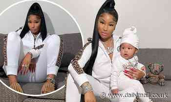 Nicki Minaj cradles nine-month-old son 'Papa Bear' as the duo sport matching designer tracksuits