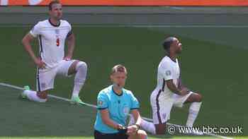 Boos drowned out as England take the knee