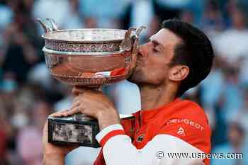 The Latest: Djokovic Gives Racket to Supportive Young Fan