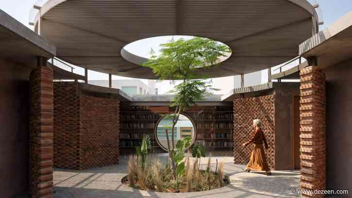 Tree grows through circular opening in courtyard canopy of Mexico house by Daniela Bucio Sistos