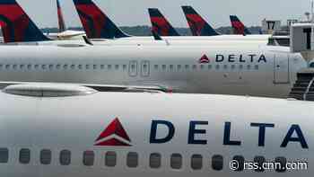 Off-duty flight attendant allegedly choked a crew member and claimed to be seated next to a terrorist before being subdued, police report says