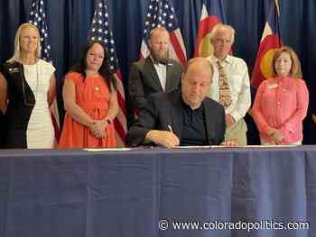 Polis signs state stimulus bills on energy, business, arts and events - coloradopolitics.com
