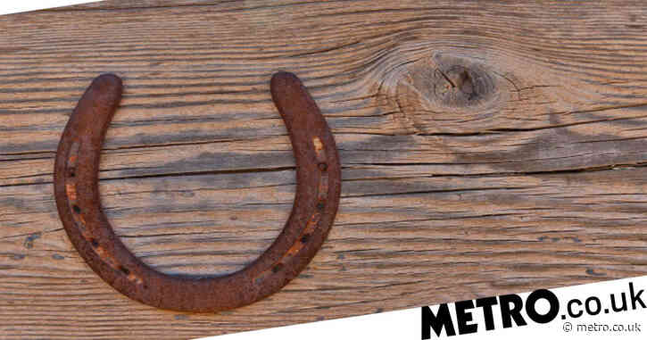 Why are horseshoes considered lucky and which way should you hang them?