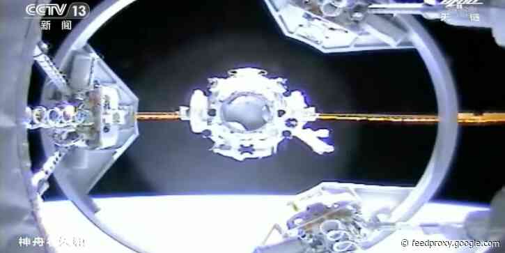 Video shows a Chinese spacecraft carrying 3 astronauts successfully docking with part of its new space station