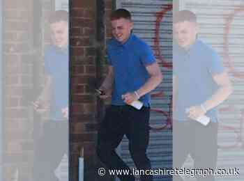 Man wanted after racist graffiti sprayed on shop wall