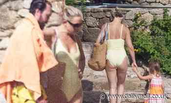 Kate Hudson, 42, models a yellow swimsuit while on the beach in Greece with family