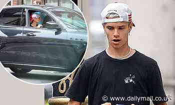 Romeo Beckham, 18, is spotted at the wheel of a £65,000 Maserati before hanging out with pal HRVY
