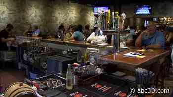 Bartenders, servers smiling faces visible as Cal/OSHA lifts mask mandate for employees