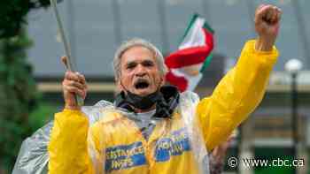 Protesters in Toronto rally against an Iranian election they call a 'sham' - CBC.ca