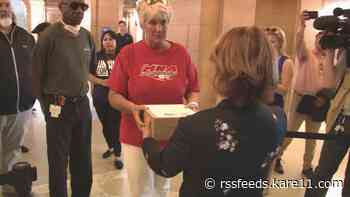 Essential workers press for COVID back pay