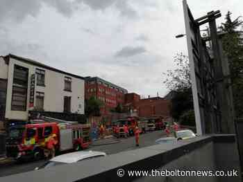 Rubbish fire building shuts Bolton town centre road - The Bolton News