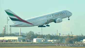 Queensland authorities urgently trace source of Emirates flight attendant's COVID-19 infection