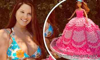 Lana Del Rey puts on a busty display in a blue floral bikini top for her 36th birthday