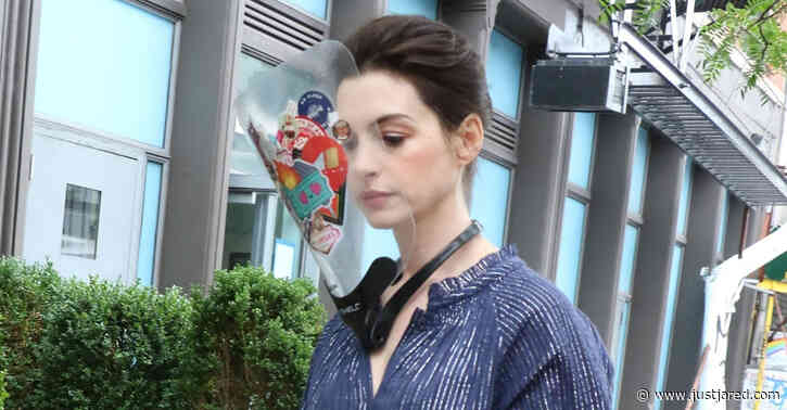 Anne Hathaway Wears Faceshield Covered with Stickers on 'WeCrashed' Set