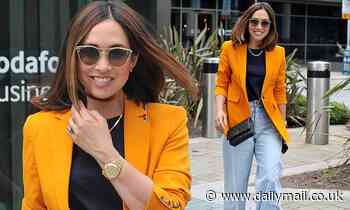 Myleene Klass shows off her sense of style in a bright orange blazer and mom jeans