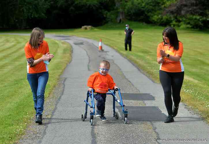 PICTURES: Four-year-old Harry Ritchie-Mackenzie who was born with a congenital heart defect and was thought would never walk puts his best foot forward and covers 500 metres around the grounds of Culloden House Hotel in aid of the Maggie's High - Invernes