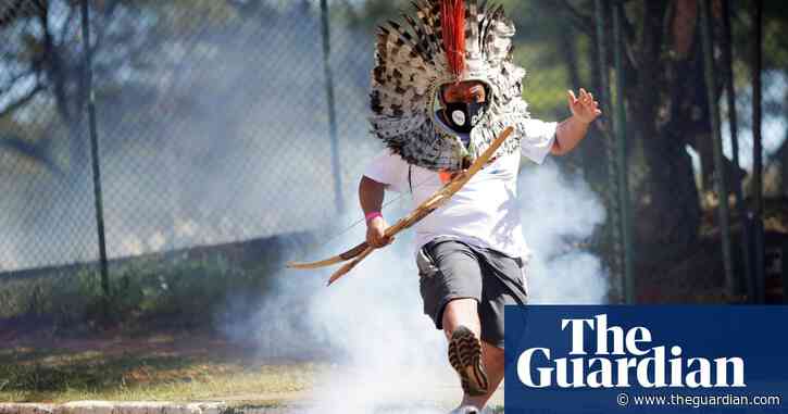 Riot police use teargas on indigenous protesters for land rights in Brazil – video