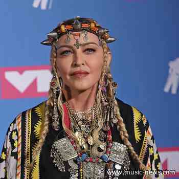 Madonna stuns gay fans with breast-baring Pride club performance