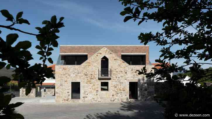 Tiago Sousa inserts brick house into stone ruin in Portugal