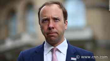 Britain's beleaguered health secretary resigns after being caught kissing aide