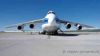Enormous aircraft, loaded with oil well rigs, launches from Calgary airport - CTV Toronto