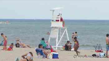 Hundreds flock to the beach in attempt to beat the heat