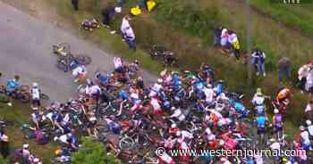 Fan Holding Sign Causes Massive Pileup at Tour de France