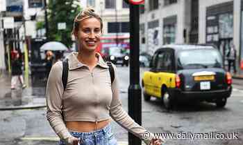 Ferne McCann teases a glimpse of her toned midriff in a taupe top