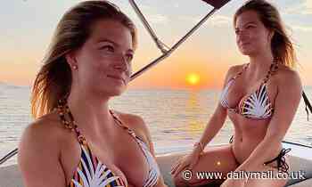 Disgraced Love Island star Zara Holland showcases her curves in striped bikini