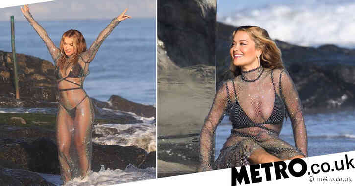 Rita Ora makes waves in glitzy sheer dress as she frolics on the beach for music video shoot