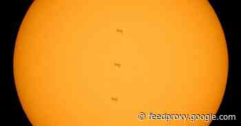NASA shares stunning view of ISS crossing in front of the sun     - CNET