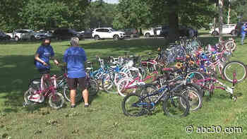Healthcare worker, police officer combine forces gift nearly 100 bikes to neighborhood kids