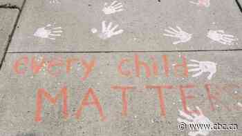 Hamilton neighbours chalk handprints on sidewalk to support Indigenous communities