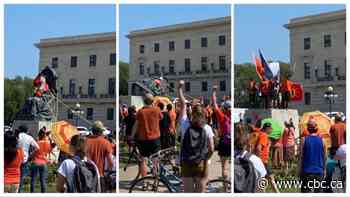 Crowd topples Queen Victoria monument at Manitoba Legislature