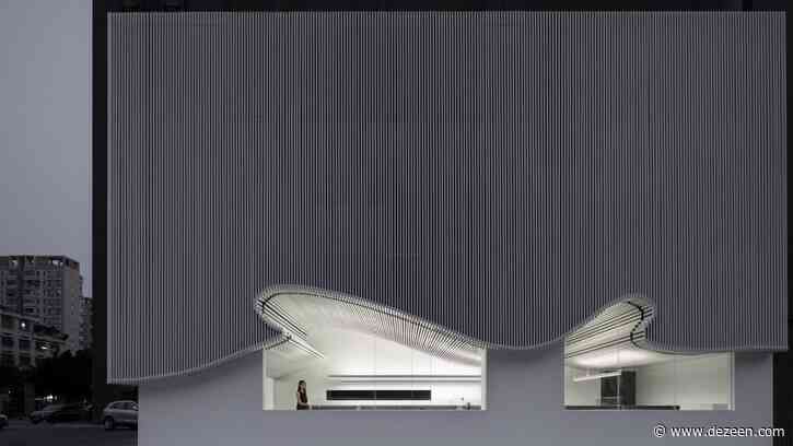 Runxuan Textile Office features curvilinear aluminium facade